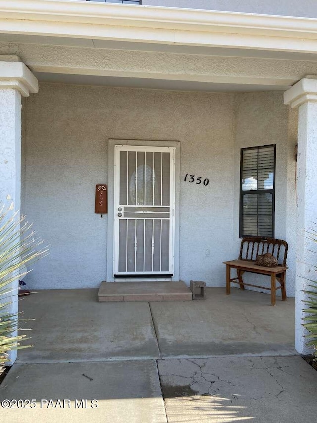 1350 W Justray Ranch Rd, Chino Valley, AZ 86323 - property entrance featuring stucco siding and a porch