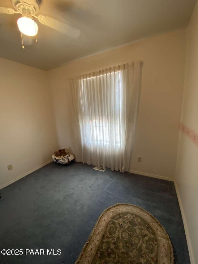 1350 W Justray Ranch Rd, Chino Valley, AZ 86323 - carpeted spare room with a ceiling fan and baseboards