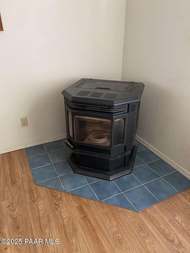 1350 W Justray Ranch Rd, Chino Valley, AZ 86323 - detailed view of a wood stove and baseboards