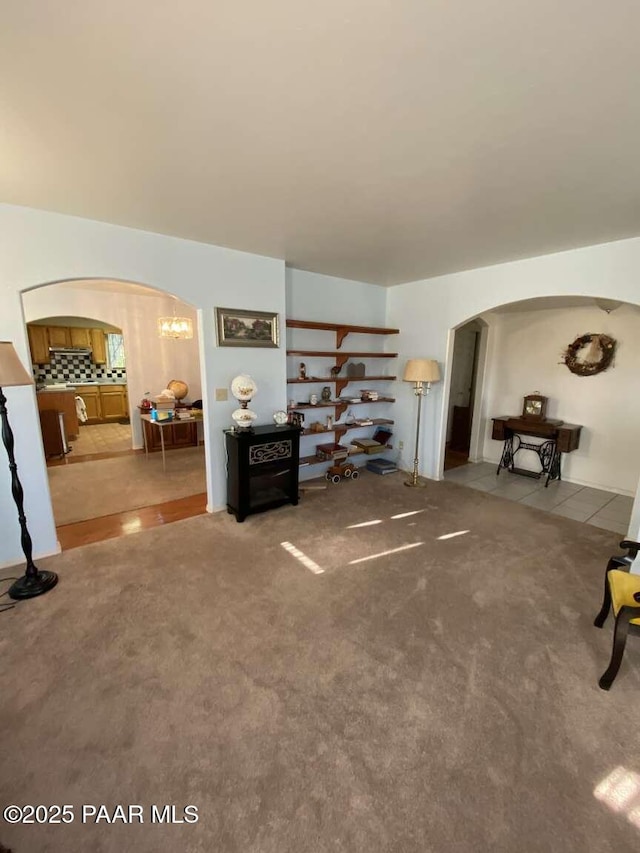 1350 W Justray Ranch Rd, Chino Valley, AZ 86323 - living area with arched walkways and carpet
