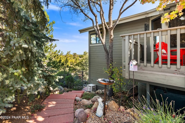 view of side of property featuring a wooden deck