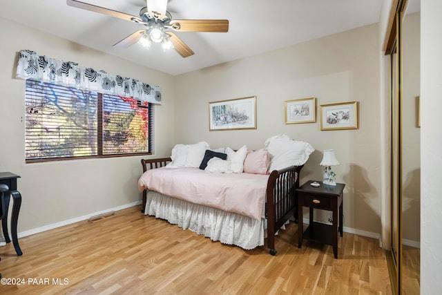 bedroom with wood-type flooring and ceiling fan