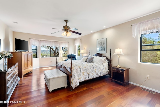 bedroom featuring ceiling fan and dark hardwood / wood-style flooring