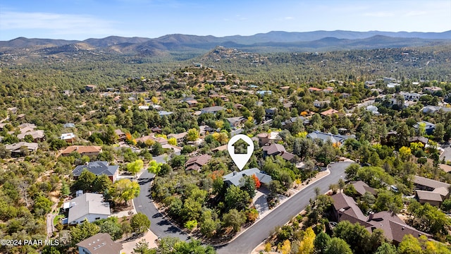 birds eye view of property with a mountain view