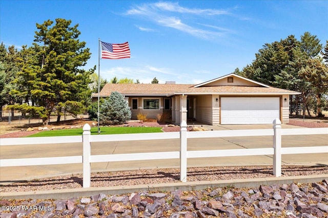 single story home with a garage and concrete driveway