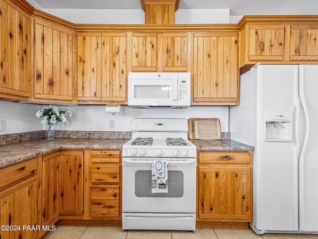 18301 S Peeples Valley Rd, Peeples Valley, AZ 86332 - kitchen with light tile patterned floors and white appliances