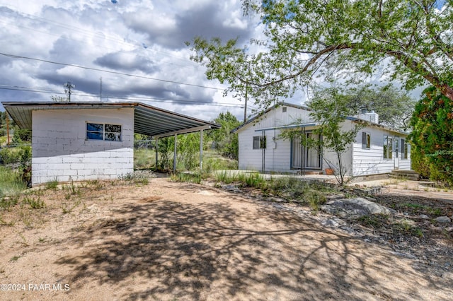 exterior space featuring a carport