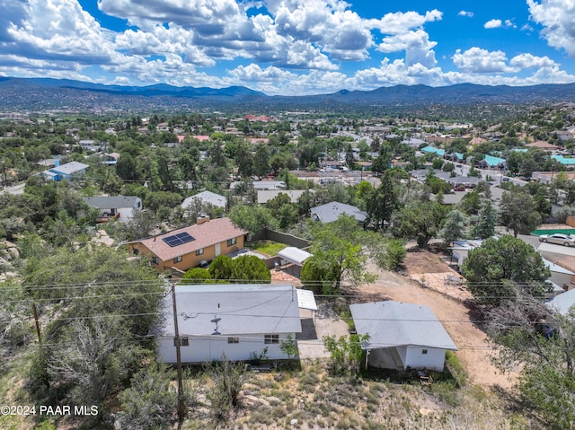 birds eye view of property with a mountain view