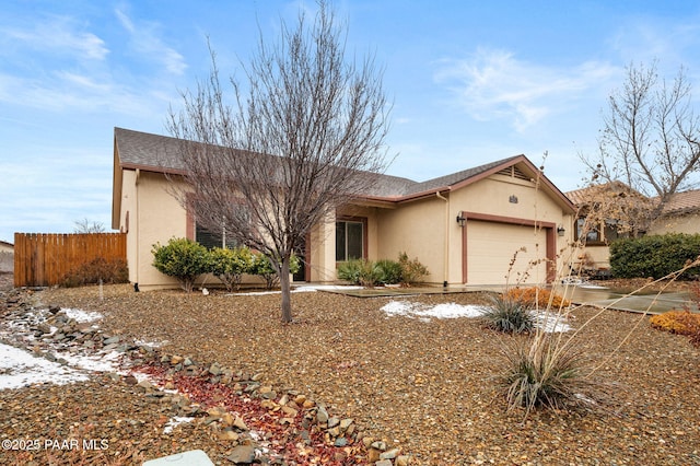 ranch-style home featuring a garage