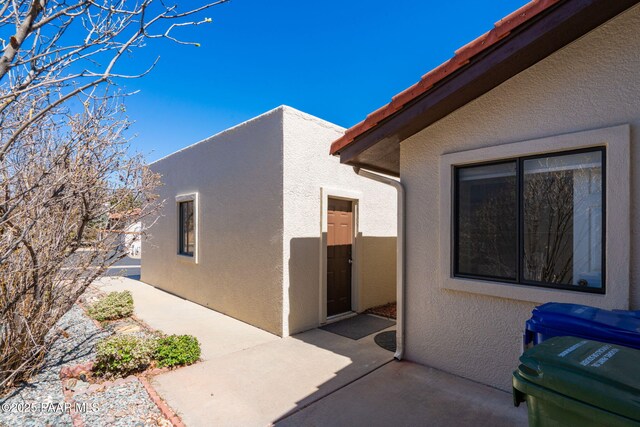 439 Foxfire Ln, Prescott, AZ 86301 - view of home's exterior featuring stucco siding and a patio area