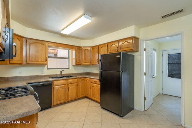 439 Foxfire Ln, Prescott, AZ 86301 - kitchen with black appliances, a sink, light tile patterned floors, and brown cabinets