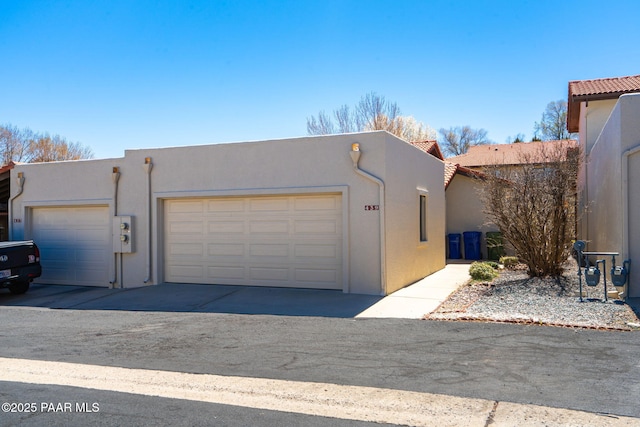 439 Foxfire Ln, Prescott, AZ 86301 - view of front of home featuring stucco siding, a garage, and a tiled roof
