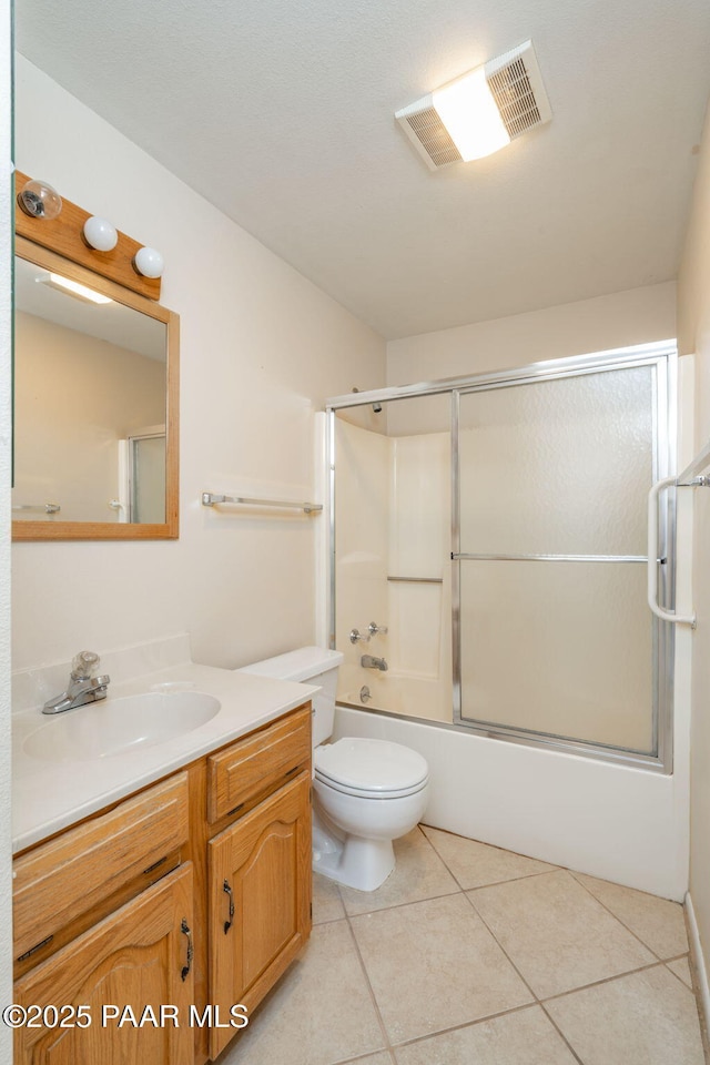 439 Foxfire Ln, Prescott, AZ 86301 - full bathroom with tile patterned floors, toilet, vanity, and shower / bath combination with glass door
