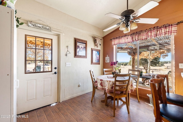 dining room featuring hardwood / wood-style flooring, ceiling fan, lofted ceiling, and a wealth of natural light