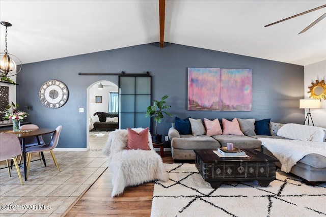 living room with tile patterned flooring, a notable chandelier, and vaulted ceiling with beams