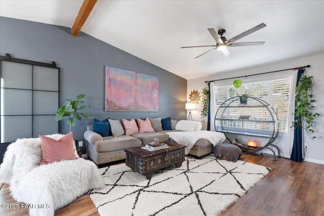 living room with hardwood / wood-style flooring, lofted ceiling with beams, and ceiling fan