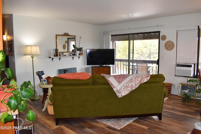 living room featuring cooling unit and wood finished floors