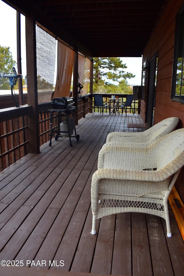 wooden deck with area for grilling