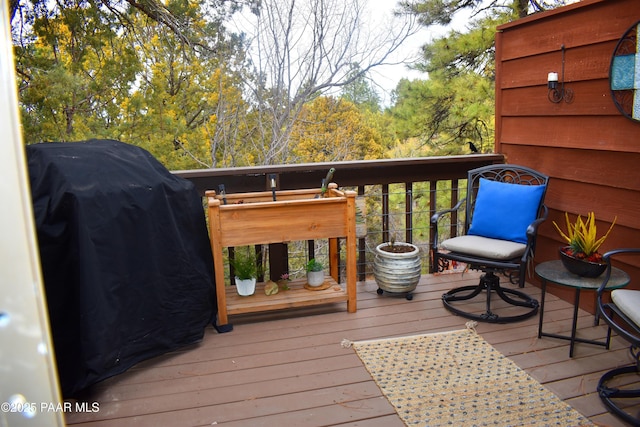 wooden deck featuring area for grilling