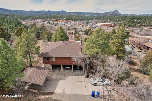 birds eye view of property featuring a mountain view