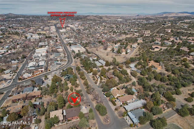 drone / aerial view with a residential view and a mountain view