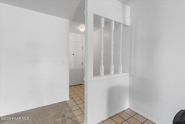 hallway with light tile patterned flooring