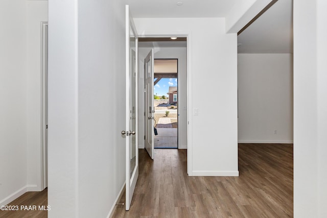 hall with hardwood / wood-style flooring