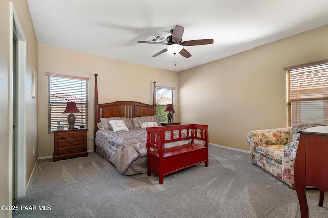 bedroom with visible vents, baseboards, ceiling fan, and carpet flooring