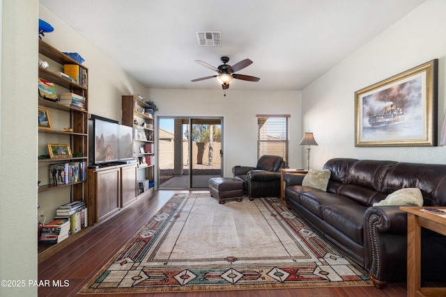 living area featuring visible vents, ceiling fan, and hardwood / wood-style flooring