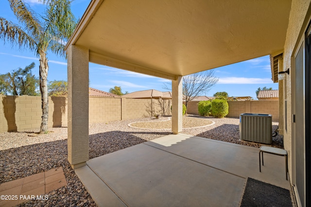 view of patio featuring a fenced backyard and central AC