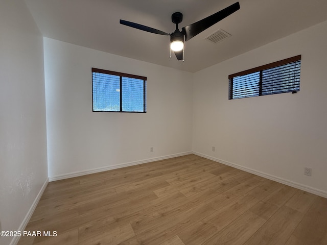 8470 E Sommer Dr, Prescott Valley, AZ 86314 - empty room featuring plenty of natural light, light wood-style flooring, and ceiling fan