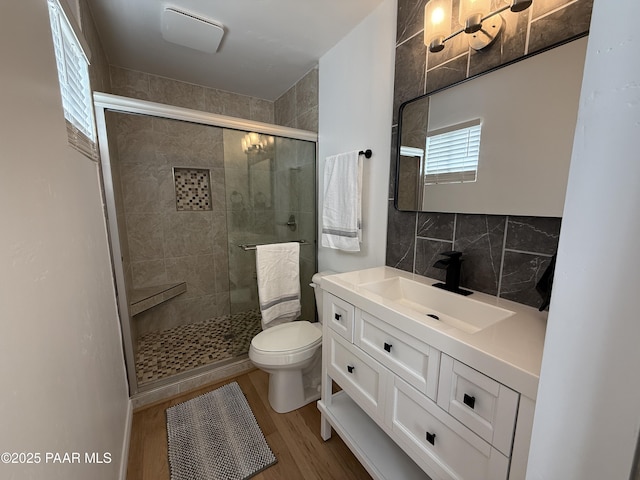 8470 E Sommer Dr, Prescott Valley, AZ 86314 - bathroom with wood finished floors, toilet, a shower stall, and vanity