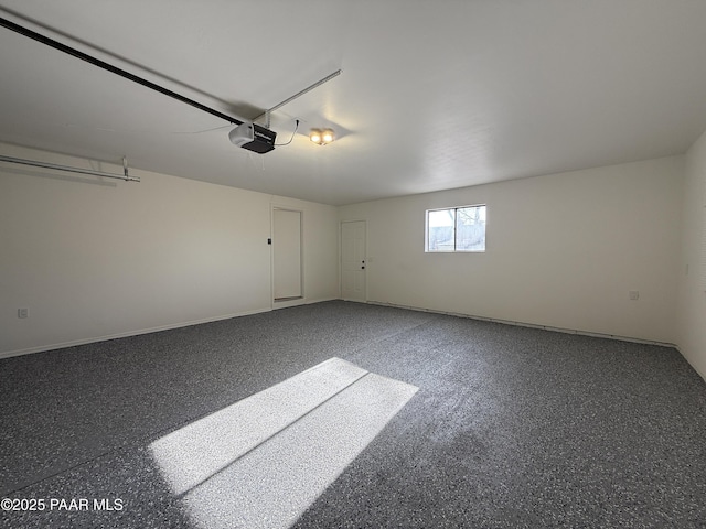 8470 E Sommer Dr, Prescott Valley, AZ 86314 - garage featuring a garage door opener and baseboards