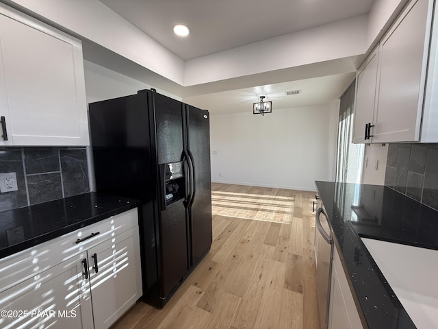 8470 E Sommer Dr, Prescott Valley, AZ 86314 - kitchen with black fridge with ice dispenser, light wood-type flooring, tasteful backsplash, white cabinets, and recessed lighting