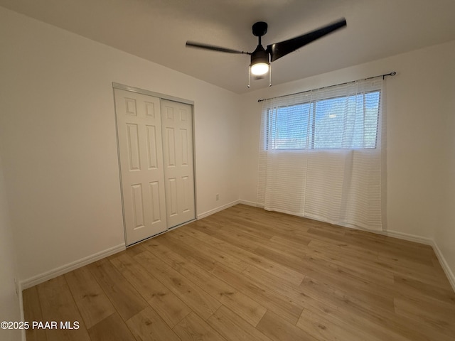 8470 E Sommer Dr, Prescott Valley, AZ 86314 - unfurnished bedroom featuring light wood-style floors, a closet, baseboards, and ceiling fan
