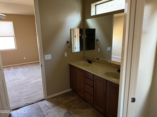 bathroom featuring plenty of natural light and vanity