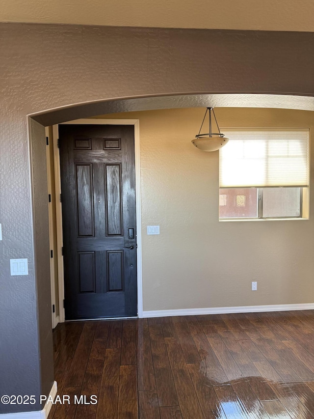 foyer featuring dark hardwood / wood-style floors