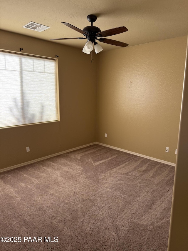 unfurnished room with carpet floors and ceiling fan