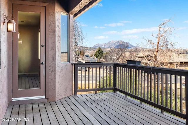 wooden terrace with a mountain view