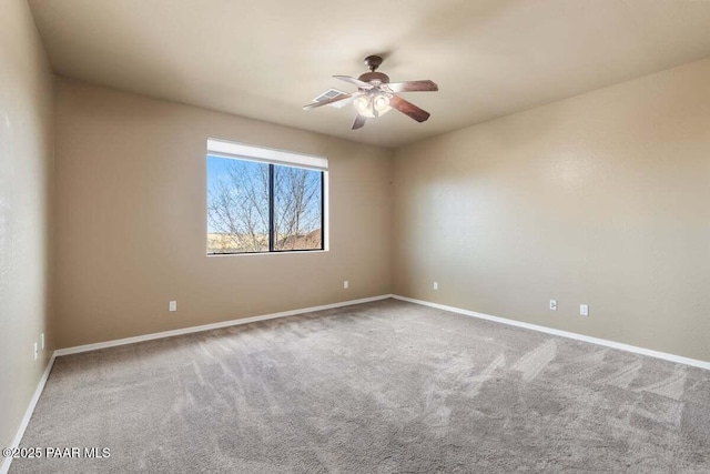 empty room with carpet, baseboards, and ceiling fan