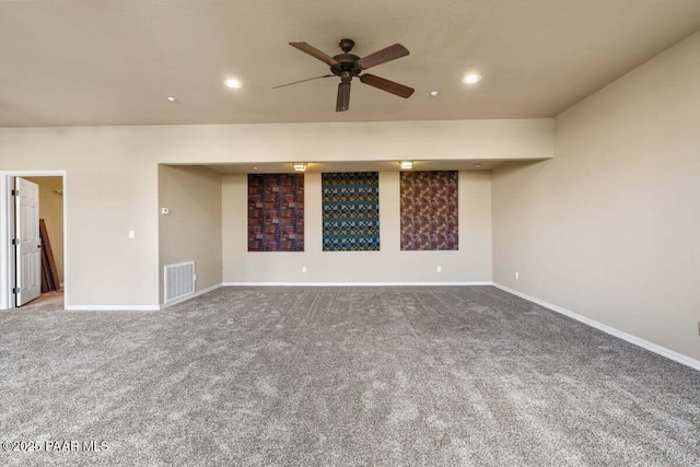 spare room with recessed lighting, carpet flooring, visible vents, and baseboards