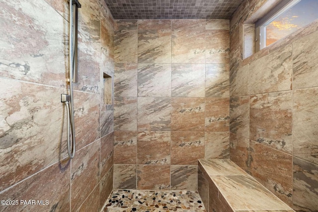 full bathroom with tiled shower