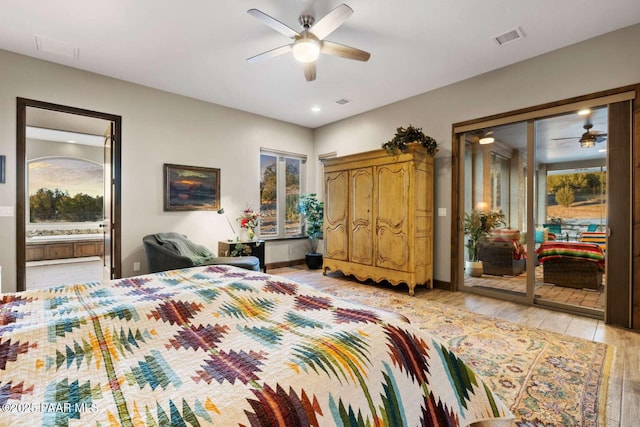 bedroom with light wood-type flooring, visible vents, ensuite bathroom, baseboards, and ceiling fan