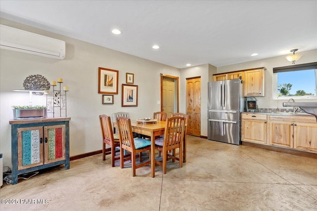 455 Bernice Dr, Chino Valley, AZ 86323 - dining room with a wall mounted AC, recessed lighting, concrete flooring, and baseboards