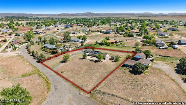 455 Bernice Dr, Chino Valley, AZ 86323 - aerial perspective of suburban area with property boundaries highlighted and a mountain backdrop