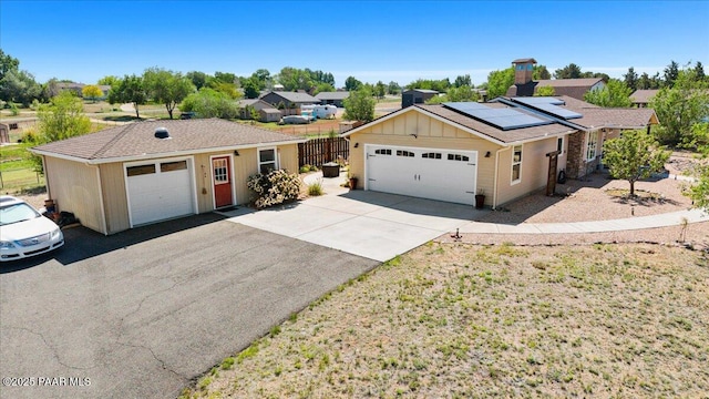 455 Bernice Dr, Chino Valley, AZ 86323 - single story home with a garage, solar panels, and board and batten siding