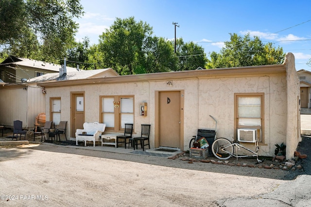 back of house with a patio area and cooling unit