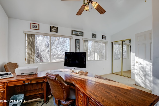 office space featuring ceiling fan, light colored carpet, and lofted ceiling