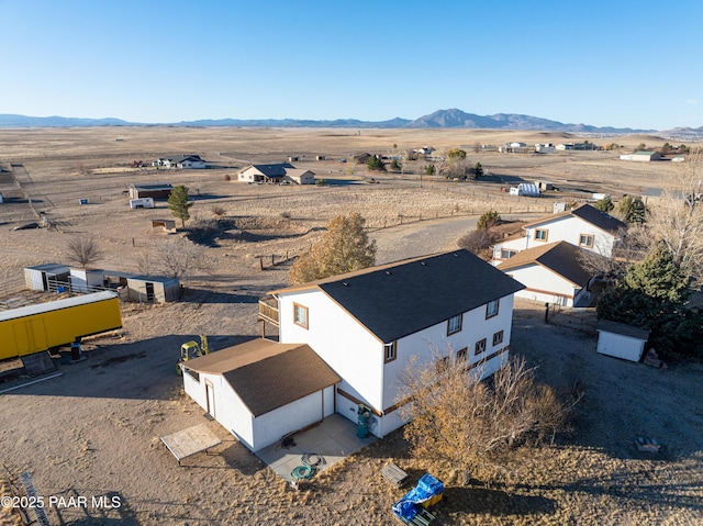 birds eye view of property with a mountain view