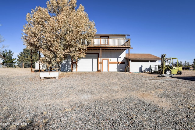 view of front of home with a wooden deck and a garage